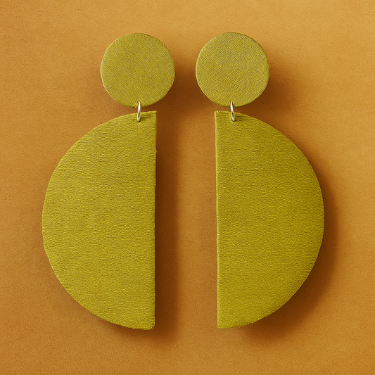 Green premium fabric earrings on a brown background